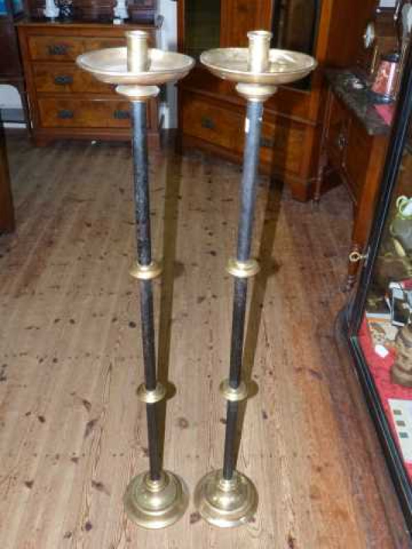 Pair of cast metal and brass altar candle holders, 122cm high
