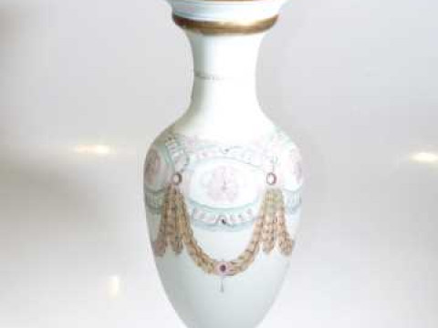 Opaque and glass pedestal vase style table lamp with floral and swag decoration
