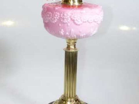 Brass column oil lamp with pink glass reservoir