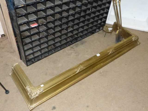 Brass fender, three brass fire irons and trivet