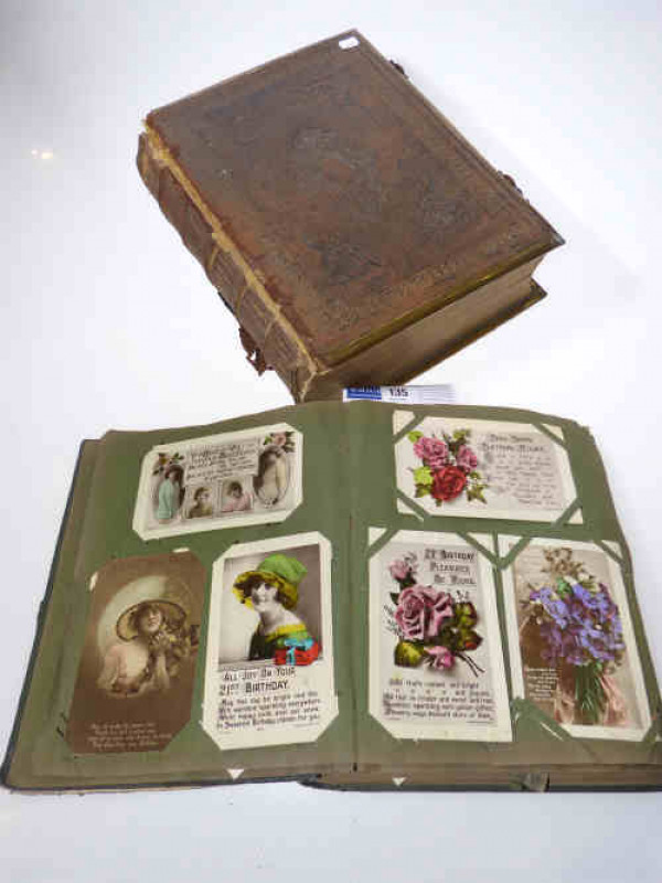 Holy Bible and postcard album of vintage postcards