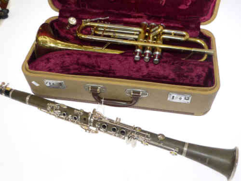 Cased trumpet and clarinet