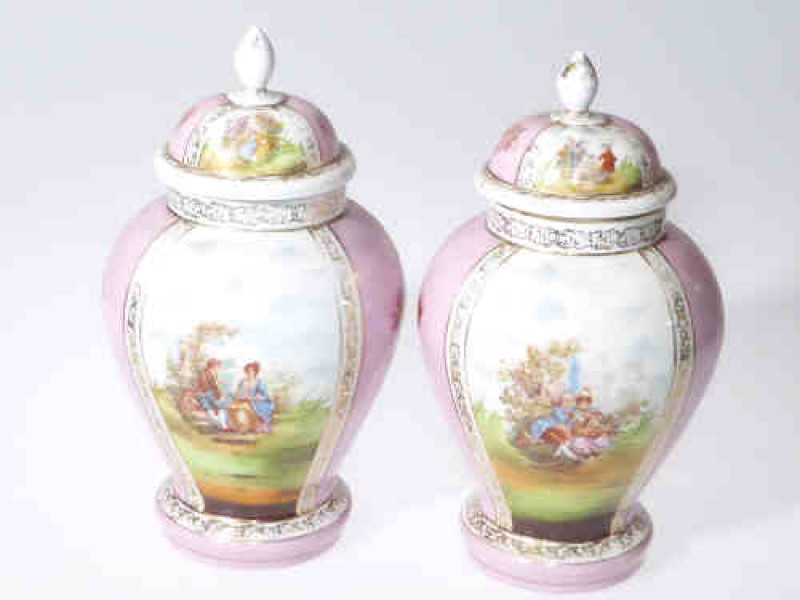 Pair continental vases and covers, decorated with romantic couples, 28cm high