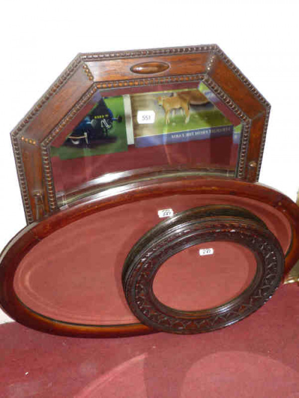 Three wooden framed wall mirrors