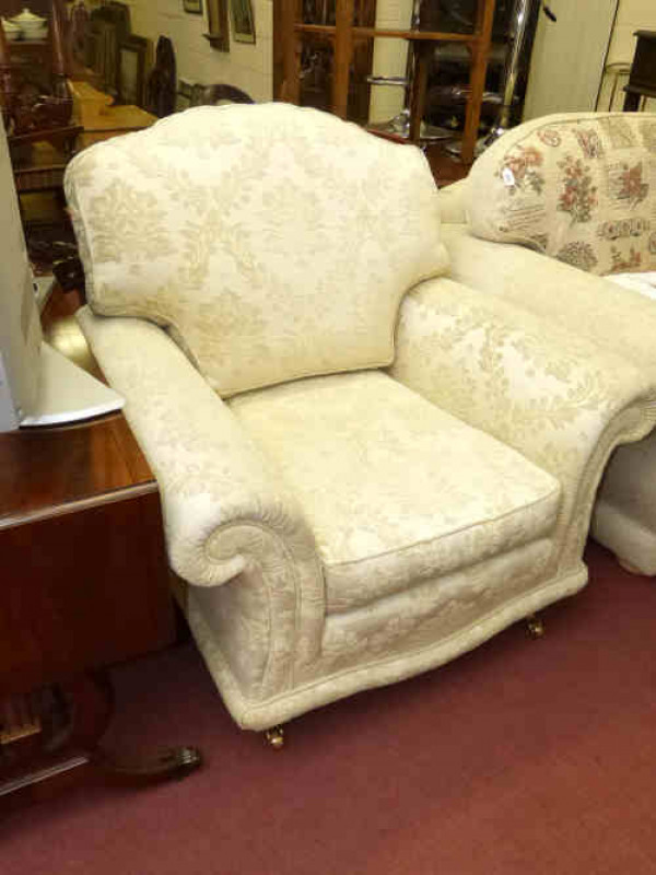 Easy chair in light foliate patterned fabric