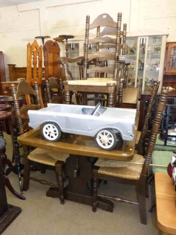 Rectangular dining table and six rush seated dining chairs