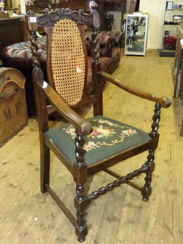 Carved oak bergere panel back elbow chair