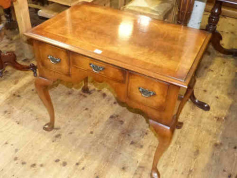 Queen Anne style walnut three drawer lowboy on cabriole legs