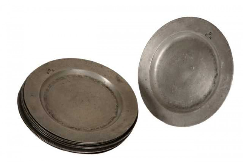 A group of nine pewter plates, mainly London touch marks, largest is 24cms wide.