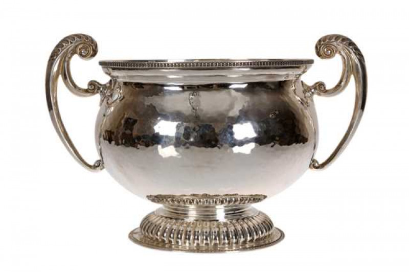 An Edwardian silver two handled bowl, James Wakely & Frank Wheeler, London 1910, of squat baluster form with beaded rims and gadrooned domed foot. Approximately 34 troy ozs, 18cm