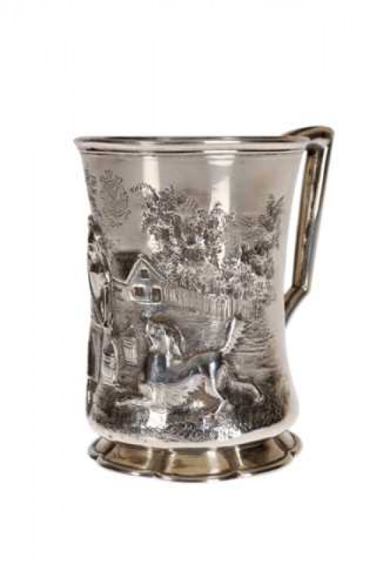 A Victorian silver tankard, Henry Holland, London 1857, slightly waisted and embossed with girl and a dog in a landscape, engraved with a monogram. Approximately 5.5 troy ozs, 10cm