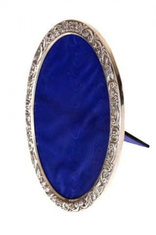 A silver photograph frame, Broadway & Co, Birmingham 1992, oval easel form with bird, mask and scroll cast mount. 24cm by 17cm
