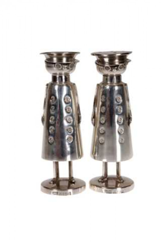 A pair of novelty silver salt and pepper pots, Birmingham 1990, modelled as chauffeurs, maker WW. Total weight approximately 2.4 troy ozs