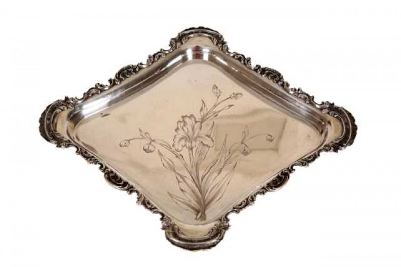 A German 800 grade silver dish, circa 1900, diamond shaped, the rim cast with C-scrolls, the well engraved with foliage, stamped marks. Approximately 22 troy ozs, 38.5cm by 34cm