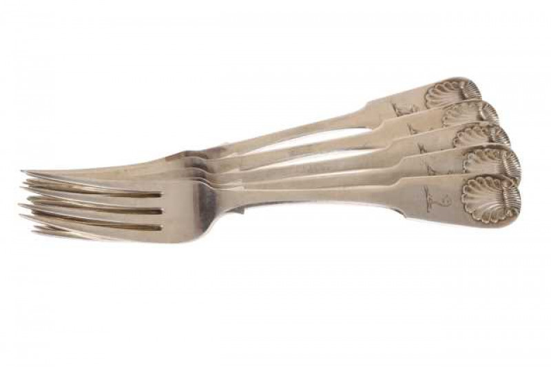 A matched set of five Scottish silver table forks, Fiddle and Shell pattern, three Hodges, Edinburgh 1830 and two Edinburgh 1828, each engraved with a crest. Approximately 12 troy ozs, 20.5cm