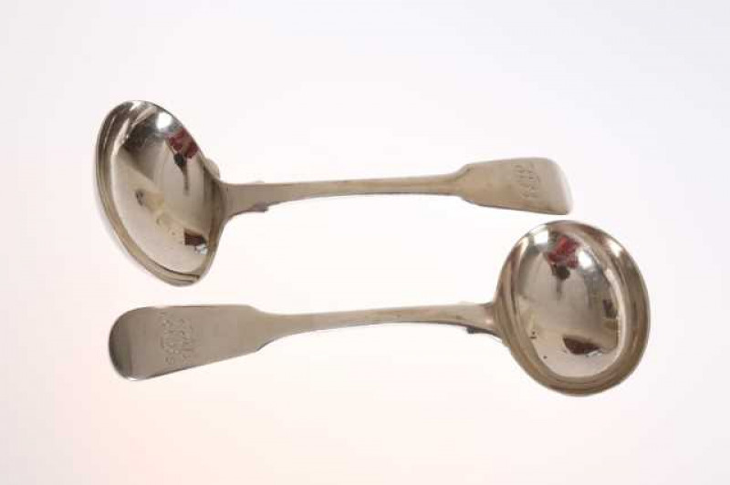 A pair of George IV silver sauce ladles, London 1826, possibly Thomas Dicks, Fiddle pattern, each engraved with a monogram. Approximately 3.9 troy ozs, 17cm