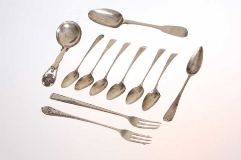 A collection of silver, comprising a set of six George Gray teaspoons, Norwegian 830 grade commemorative spoon, engraved NORGE 1945; Georgian dessert spoon, Eley & Fearn; Edinburgh silver teaspoon and two silver pickle forks. (11) Total weight approximate
