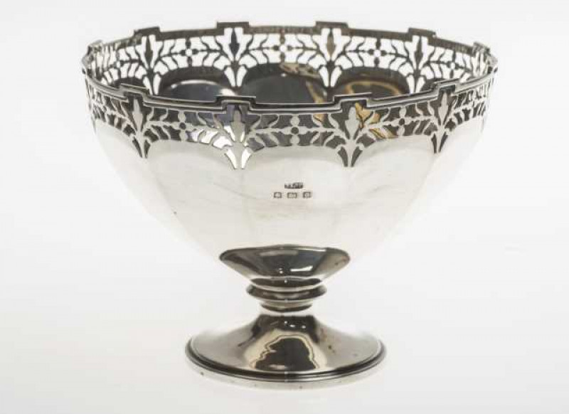 A George V silver bowl, Birmingham 1913, of tapering faceted form with pierced rim. Approximately 4.3 troy ozs, 9.5cm by 12cm