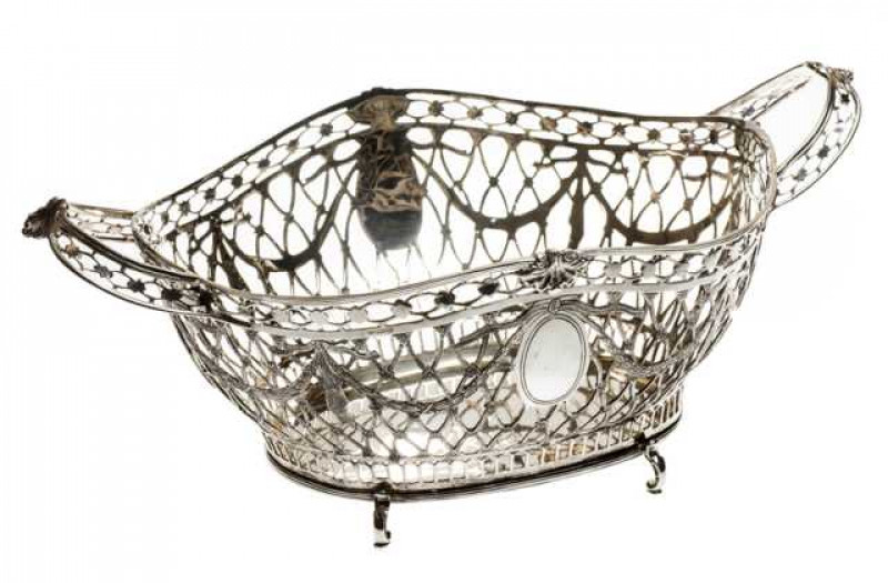 Hazorfim: A large 800 grade pierced silver two handled bowl, cast with pendant leafy swags and raised on C-scroll feet. Approximately 47 troy ozs, 46cm across handles