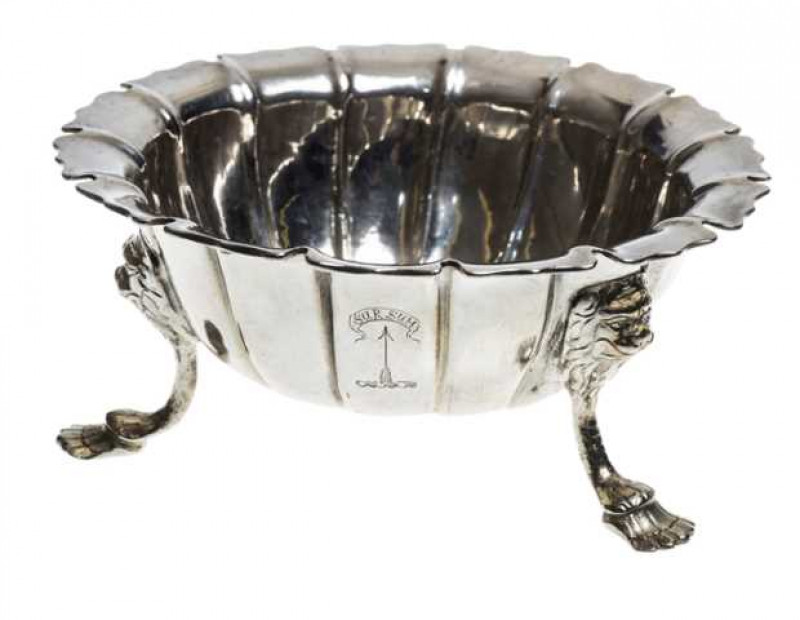 A George II Irish silver bowl, Dublin, probably 1743, circular with overturned shaped rim, raised on lion mask capped legs, engraved with a motto. Approximately 7 troy ozs, 13.5cm
