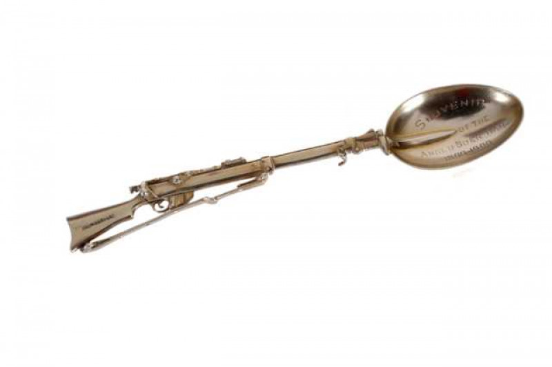 A Boer War commemorative silver spoon, Saunders & Shepherd, London 1899, in the form of a Lee-Metford rifle, engraved. 12.5cm