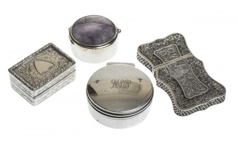 A collection of three silver pill boxes, together with a filigree card case. (4) Card case 7cm by 4cm