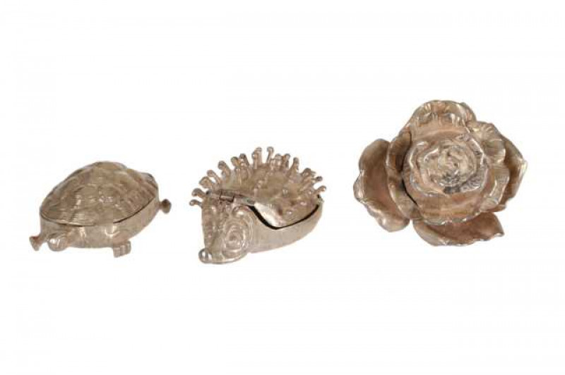 A collection of Continental novelty silver, comprising a rose with hinged compartment, turtle pill box and hedgehog pill box. (3)