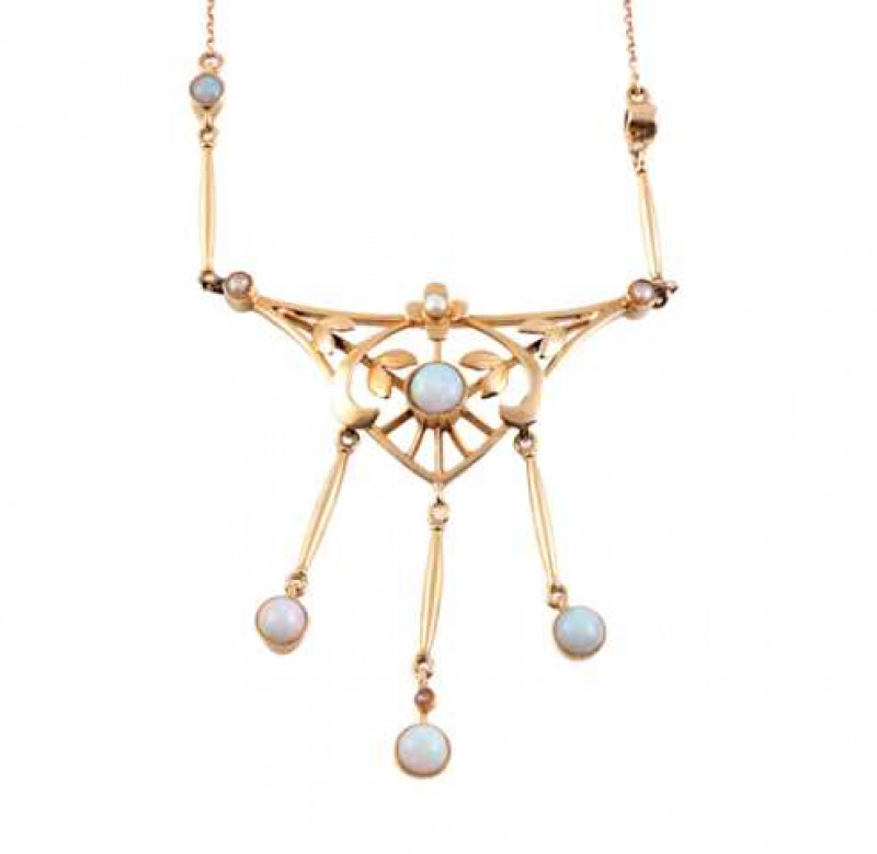 An Art Nouveau opal and seed pearl necklace, the delicate triangular shaped pendant set to the centre with a collet set round cut opal on a ray of eight knife edge bars, the two upper bars each set with a double leaf shaped mount, below a flowerhead mount