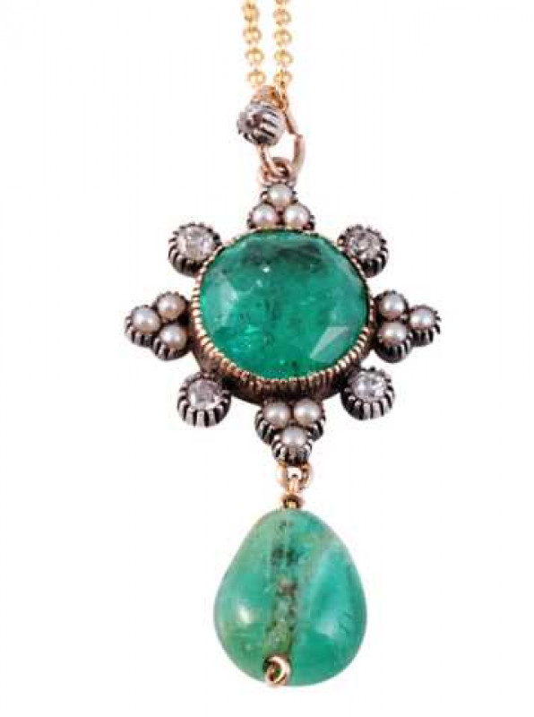 An emerald, diamond and seed pearl pendant, the pear shaped emerald drop suspending on an articulated link from a mount set to the centre with a round cut emerald, collet set within a surround of four evenly spaced round mixed cut diamonds in separate col