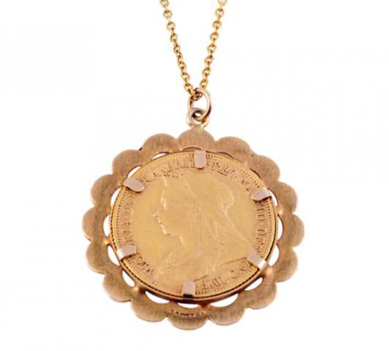 A Victorian 1899 sovereign, in a loose mount with yellow metal chain.