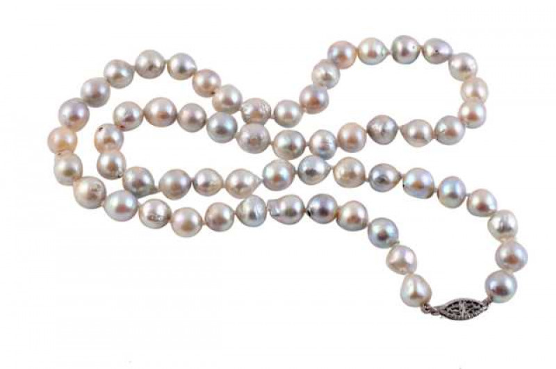 A cultured baroque pearl necklace, the fifty nine cultured pearls threaded knotted on a pierced detail integral tongue clasp. Clasp stamped 14KT. Weight approx. 35.2gms. Length approx. 25cm.