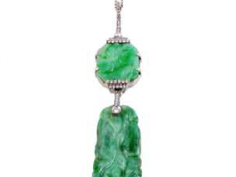 A jade and diamond pendant, the subtly carved rectangular shaped plaque...
