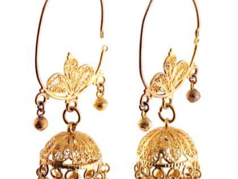 A pair of yellow coloured metal filigree drop earrings, the large oval...