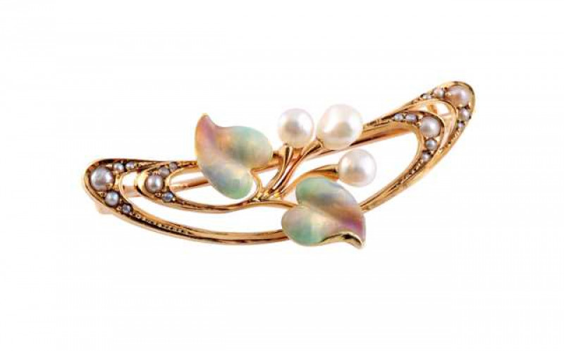 An Art Nouveau cultured pearl and enamel brooch, the open curved design set to the centre with a spray of five knife edge bars, the three central knife edge bars each set to the top with a cultured baroque pearl, the two outer knife edge bars each set to 
