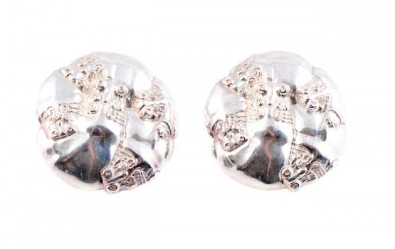 A pair of disc stud earrings, the abstract circular design set with an applied and hammered effect patterning on post and scroll fittings. Makers mark P.M. Scrolls stamped 375. Weight of one earring approx. 14.7gms. Diameter approx. 3.8cm.