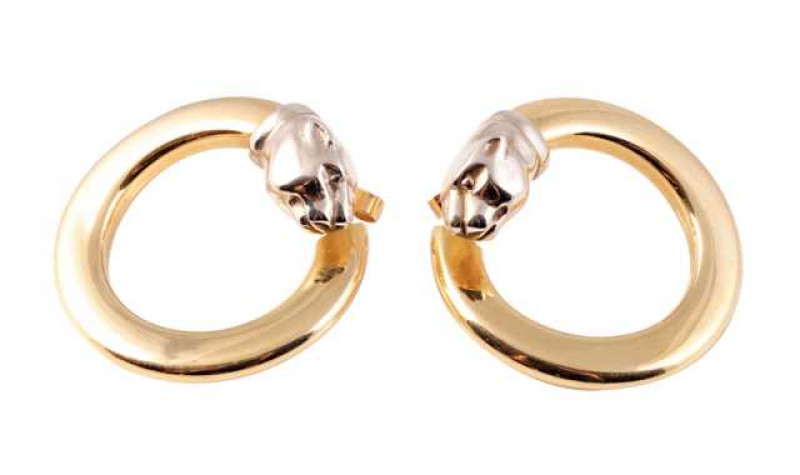 A pair of yellow coloured metal ear studs, the stylised forward facing flat hoop design set to the end with a realistically moulded tigers head, set on post and scroll fittings. Scrolls stamped 750. Weight of one earring approx. 6.6gms. Diameter approx. 3