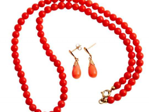 A coral necklace, the eighty four uniform coral beads strung onto a simple...