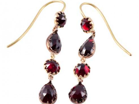 A pair of garnet drop earrings, the round mixed cut garnet collet set...