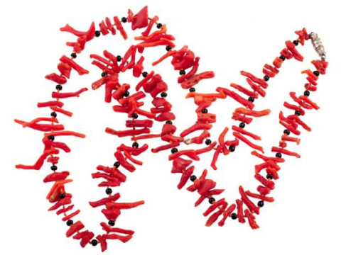 A coral and black bead necklace, the irregular shaped coral strands alternately...