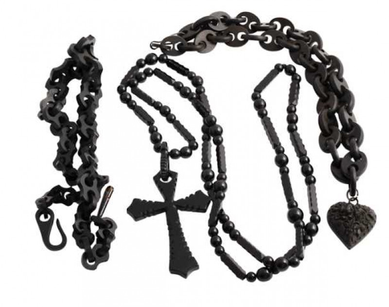 Three Victorian jet necklaces, the first of thirty three oval shaped articulated links, suspending a circular link which in turn suspends a heart shaped drop with a chased floral and foliage design with later added black metal hook clasp. Length approx. 3