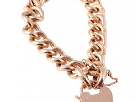 A late 19th Century yellow gold curb link bracelet, the twenty five large...