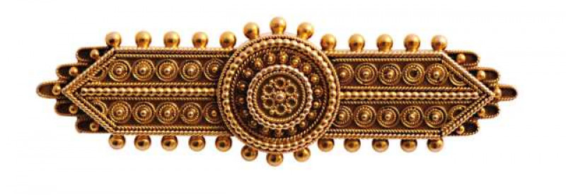 A mid Victorian brooch, the symmetrical rectangular design set throughout with delicate bead details and scroll work, set to the centre with two raised circular mounts with similar subtle bead and scroll work details. Brooch pin fittings. Stamped 15ct. We