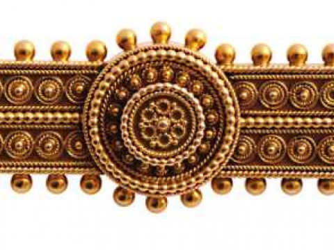 A mid Victorian brooch, the symmetrical rectangular design set throughout...