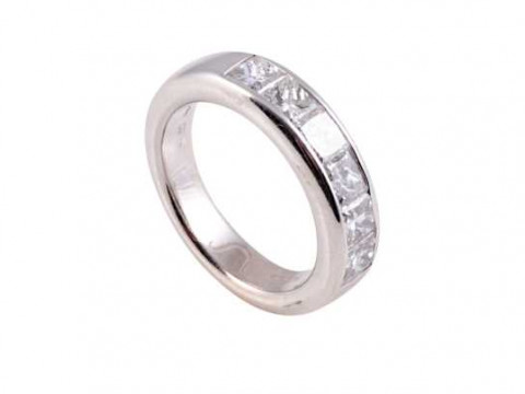 A diamond ring, the six princess cut diamonds channel set to the centre...