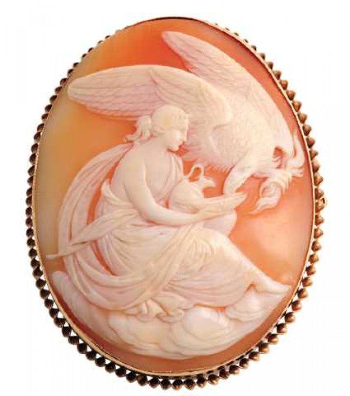 A cameo brooch, circa 1890, the oval cameo depicting an eagle eating from a bowl held by a maiden, set simply in a collet setting with subtle rope work detailing. Brooch pin fitting with safety chain. Stamped 375. Weight approx. 17.9gms. Length approx. 5c