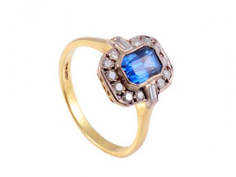 A sapphire and diamond ring, set to centre with a rectangular cut sapphire...