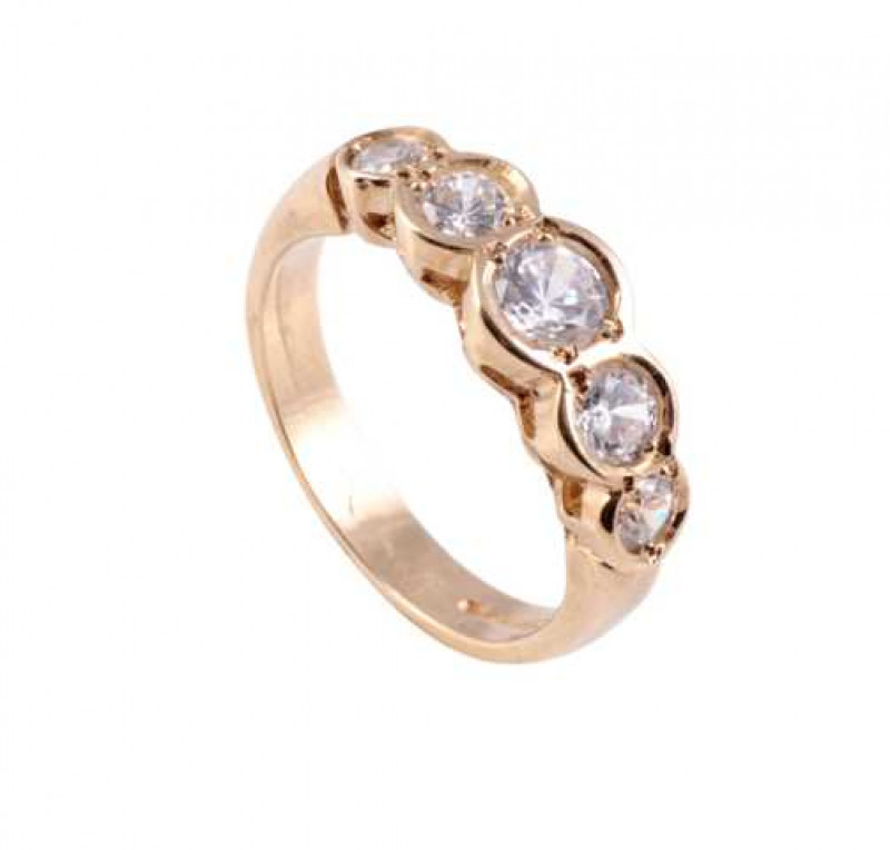 A diamond ring, the five graduating brilliant cut collet set diamonds set in a pierced detail mount on a plain band. Stamped 750. Ring size M1/2