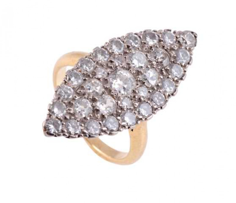A diamond ring, the marquise shaped mount set to the entirety with thirty one graduating brilliant cut diamonds, all set in a pierced open mount between open shoulders on a plain band. Ring size L.