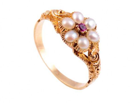A garnet and seed pearl ring, circa 1840-1850, the table cut ruby highlight...