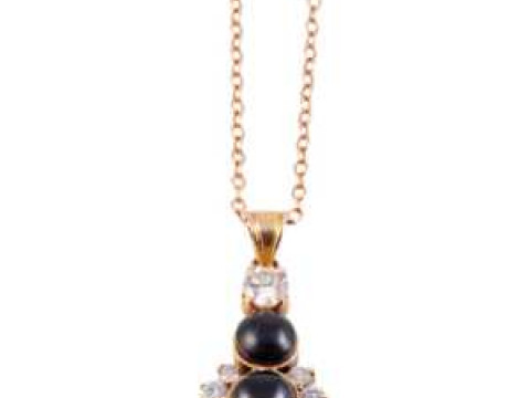 A Whitby jet and diamond pendant, set to the centre with a collet set...